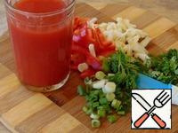 Greens, celery, peppers folded into a blender, pour tomato juice.
Add spices, salt to taste.