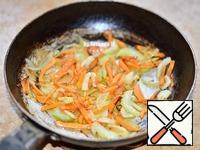 Cut vegetables and fry in oil until soft.