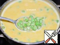 Put the vegetables in a saucepan, mash the soup with a blender.
Add spices, salt to taste and green peas. You can fill with water if desired.