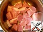 Meat cut into pieces and put in a pan as first layer.