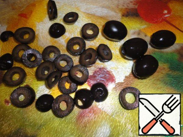 Black olives pitted cut into slices.