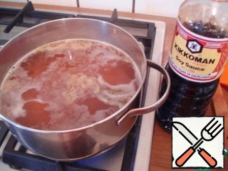 Again bring to a boil, add grated ginger and soy sauce. Continue to cook until the rice is tender.
