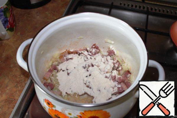 In the saucepan where you fried the bacon, add flour and fry, stirring, about 30 seconds.