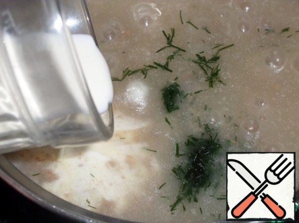 Then add heavy cream and finely chopped dill to the soup.
