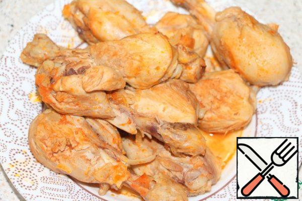 Remove the chicken pieces with a slotted spoon and let cool.
