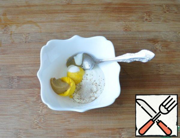 Peel the egg, rub the yolk with mustard, sour cream, salt and black pepper
