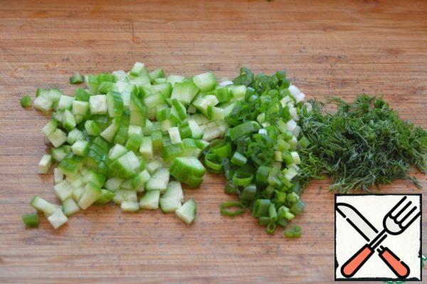 Also cut into cubes fresh cucumber, chop green onions and dill.