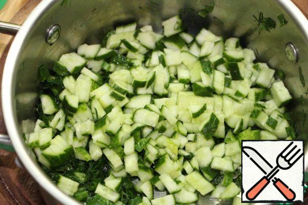 Cucumber cut into small cubes, add to the pot.
More cucumber rubbed on a grater.