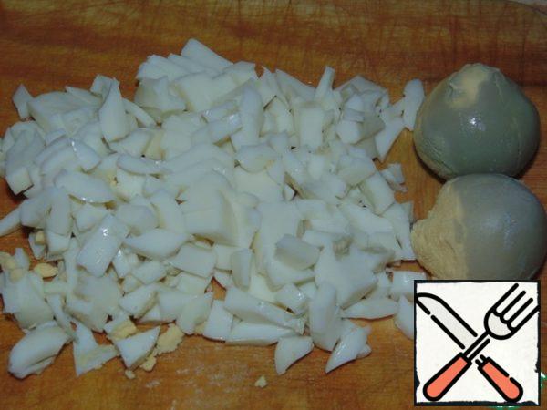 Boil the eggs.
Cut the whites into strips, put the yolks aside for now.