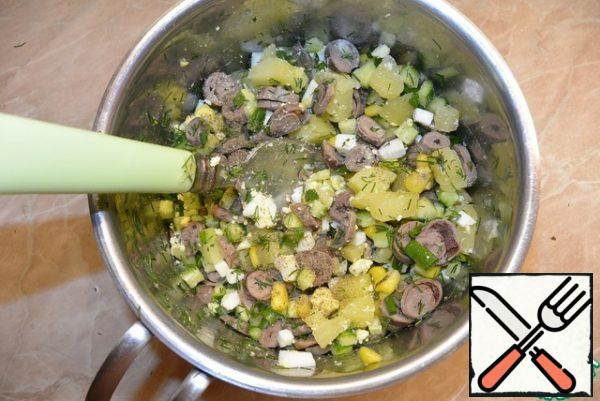 Pour in the kvass and mix the okroshka. Add salt and pepper to taste.