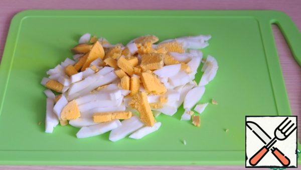 Boil the eggs, cut them.
