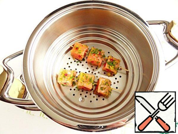 By using a steaming system, we save time. While the vegetables are being cooked until tender, I cook salmon on skewers in a saucepan set over them.
