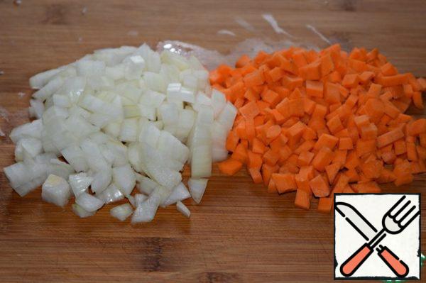 Onion and carrot cut into cubes.