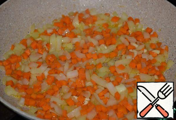 Fry in pumpkin oil until soft, add crushed garlic and fry for a few of minutes.