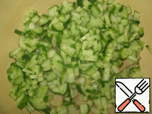 Cut cucumbers into strips.