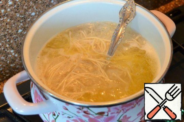 Add in the broth, the noodles, cook for 5 minutes.