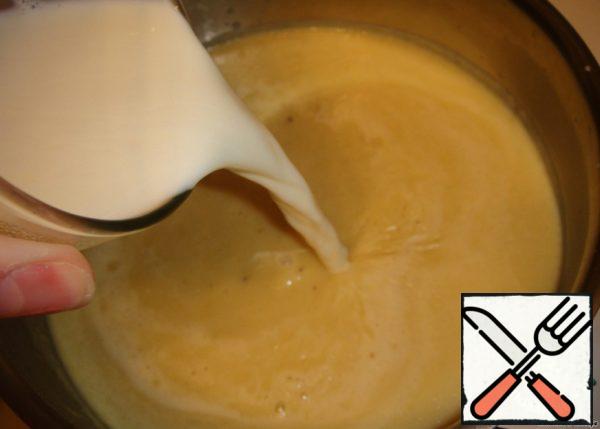 Adding hot cream.