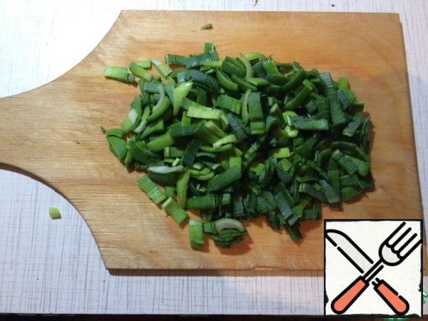 Finely chop the leek greens.
