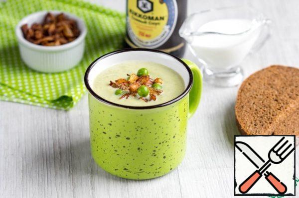 Grind the soup in a blender until smooth, add cream. Put it back on the stove and bring to a boil, stirring constantly. Serve in a plate or mug, sprinkled with crispy onions.