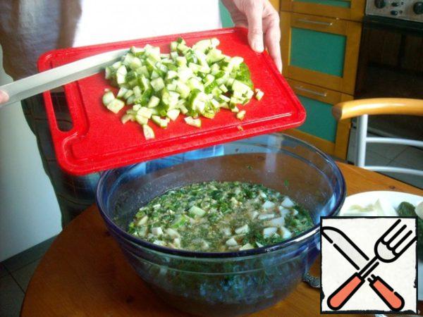 Add cucumbers. Cut the egg white and add it to the same place.
