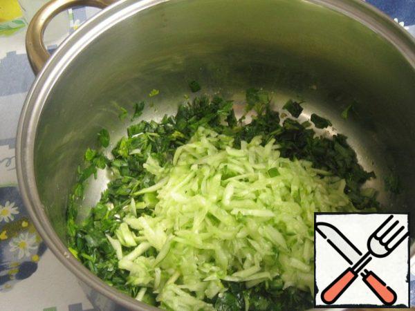 Grate cucumbers on a coarse grater.
