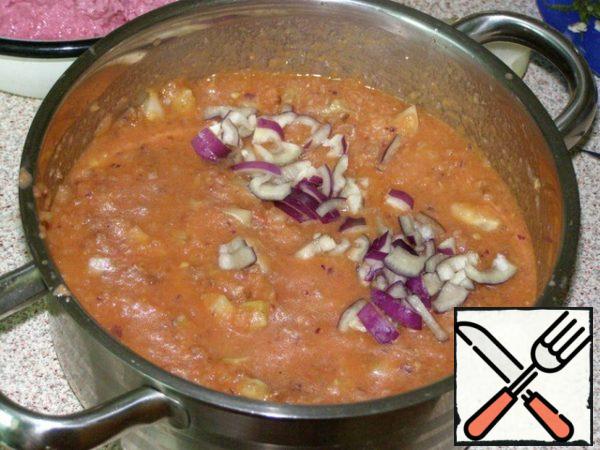 In a saucepan put cucumbers, pour tomato mixture, add onions. Mix well and let stand up to 2 hours in the refrigerator.