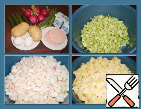 Prepare the ingredients for the okroshka.
Pour water into a saucepan, boil it.
Peel cucumbers, boiled potatoes and radishes and finely chop them.
