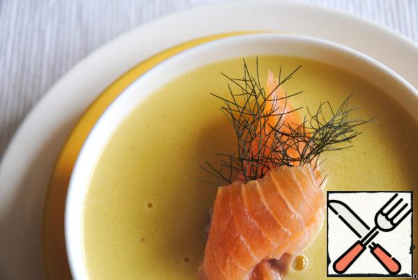Serve the soup in plates or cups, put a piece of salmon and a sprig of fennel or dill in each.