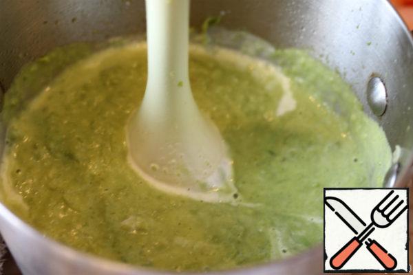 Add cream and remove from heat. Blender to whip everything into a puree. Season with salt and pepper.  Pour on plates. Garnish with greens and cream. 