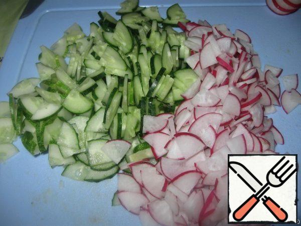 Cucumber and radish cut into small slices.