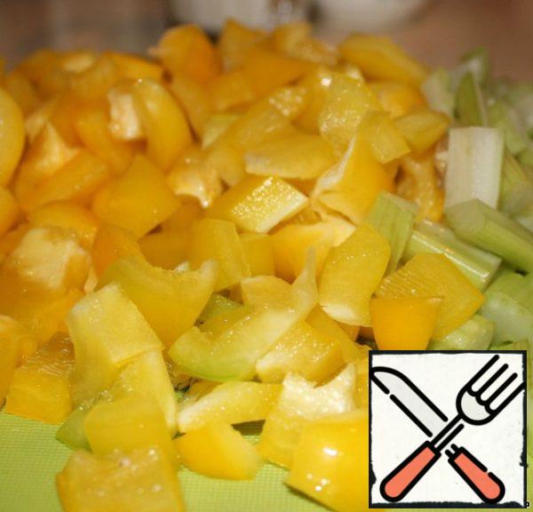Pepper and celery cut into small cubes-squares.
