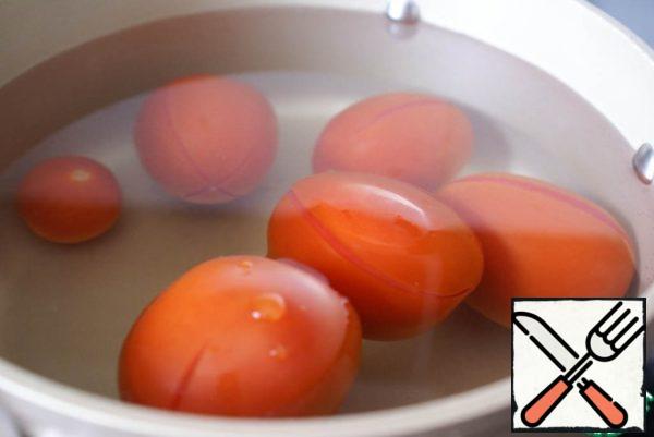 Lower tomatoes in boiling water for 30 seconds or until the skin is broken. Retrieve with a slotted spoon, cool.