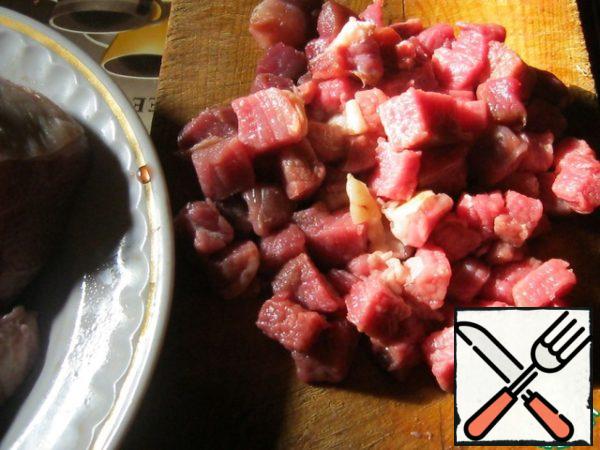The flesh of beef cut into small dice.