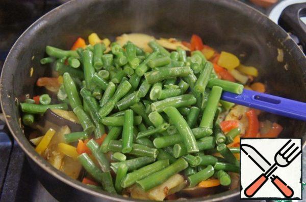 Add the cooked or thawed green beans and saute 5 minutes.
