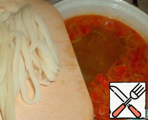 Squid cut into thin strips and add to the pot.