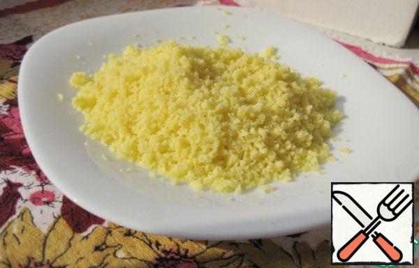 Grind the cheese in a blender (can be grated on a fine grater).