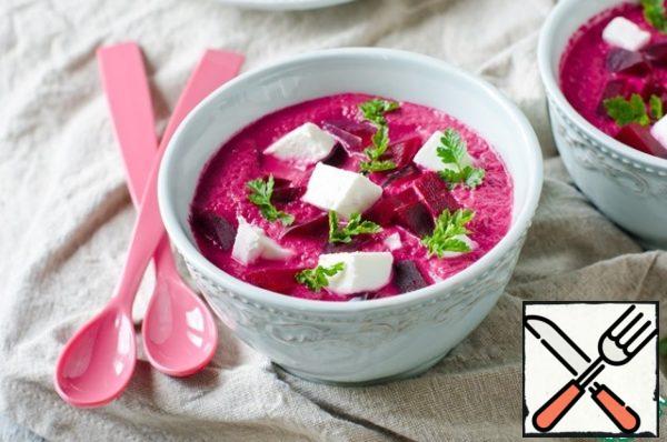 Pour the cream soup on plates or bowls, add pieces of beetroot and feta. Sprinkle with parsley.