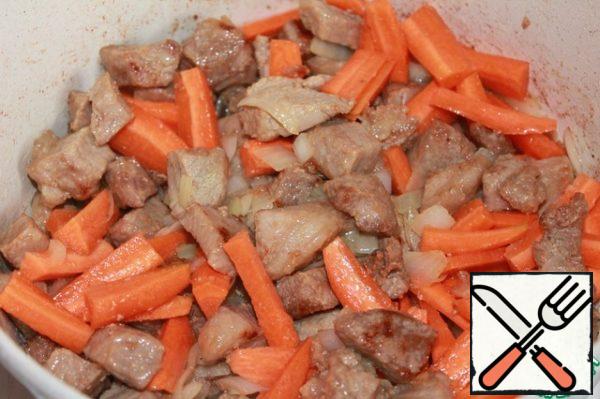 Add the chopped carrots and continue to fry.