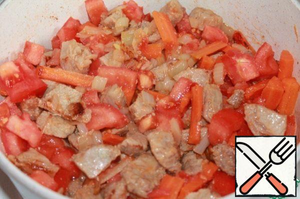 Add the chopped tomato and simmer for about 15 minutes.
