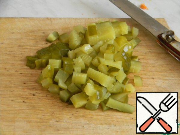 Cut cucumber into small dice and add to soup, bring to boil and cook for 5-7 minutes.