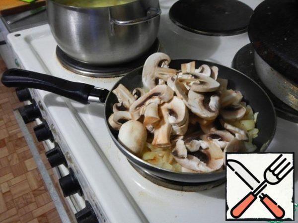 Add the mushrooms to the onion.
