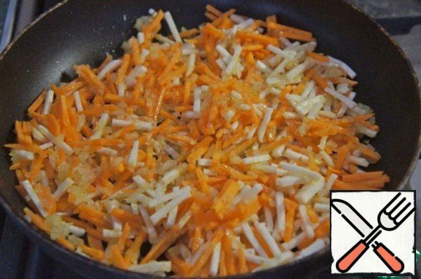 Add carrots and celery and fry over low heat until soft.