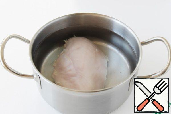 Boil the chicken breast for 20 minutes or until ready.