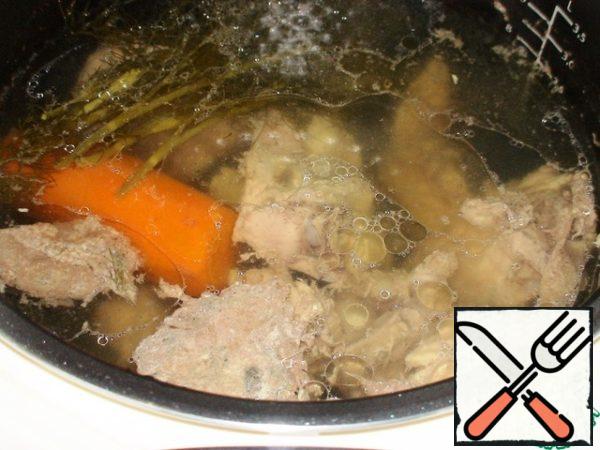 Meat wash, put in a bowl slow cooker, pour water, set mode "Soup" for 1 hour. When boils, remove the foam, add peeled carrots,onions, parsley branches.
Or, as usual, cook on a stove on a small fire for 1 hour.