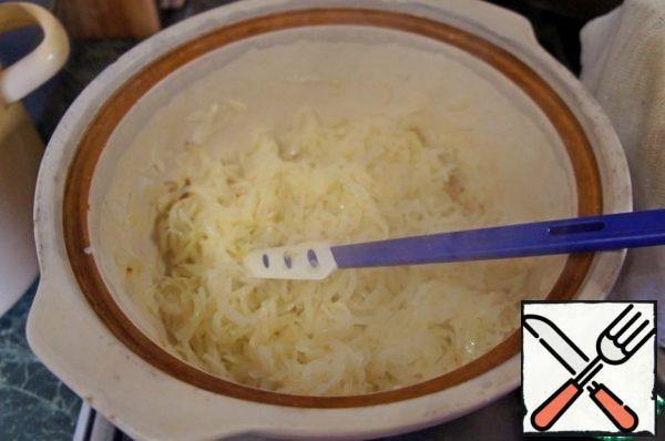 Melt the butter in a pot, put in it chopped onion until soft.