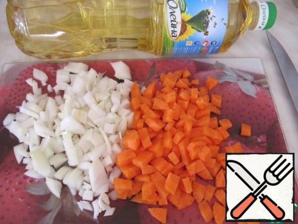 Onion and carrot cut into cubes.