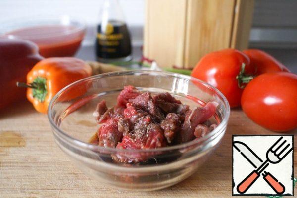 Beef cut into cubes and marinated in 2 tablespoons soy sauce with a tablespoon of vegetable oil and black pepper.