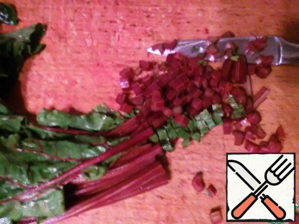 Finely chop the beet tops.
