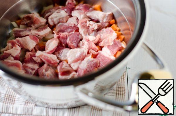 Meat, I have a piece of pork neck that is also cut into small pieces and put it on carrots and onions.