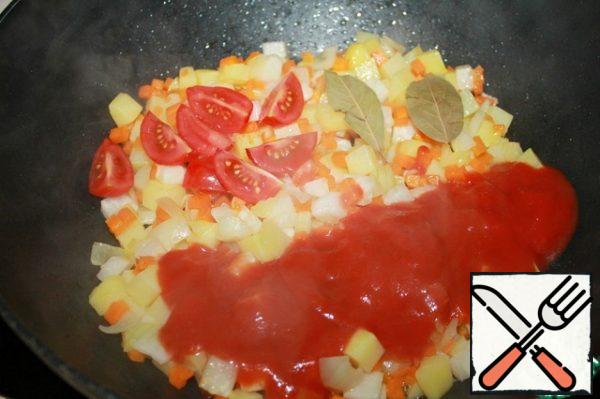 Add the Bay leaf, and sauteed tomatoes. In this case, more cherry tomatoes were added.